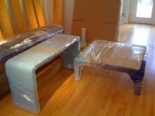 Goods wrapped in moving blankets.